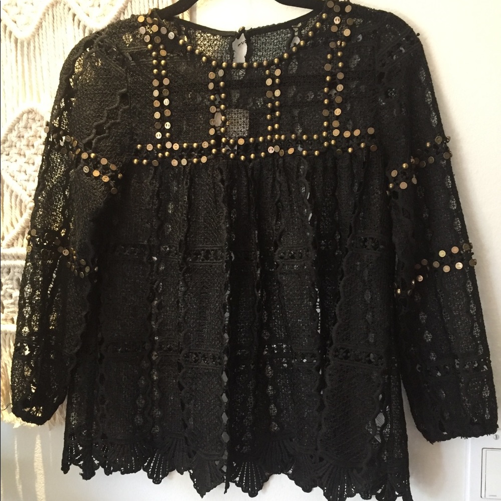 Anthropologie-Maeve black top with gold hardware.